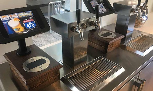 a kiosk with a beer tap